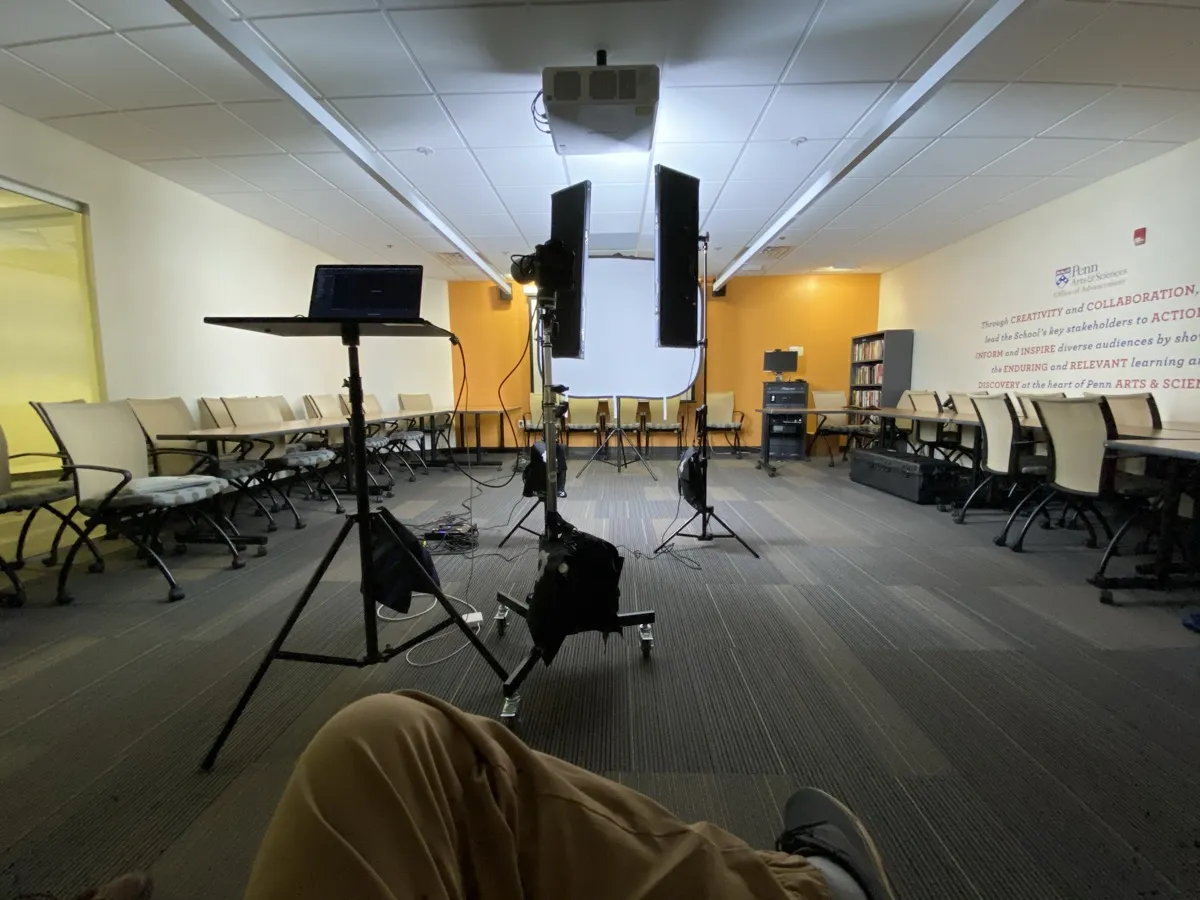Professional headshot lighting setup in a corporate conference room for team headshot day
